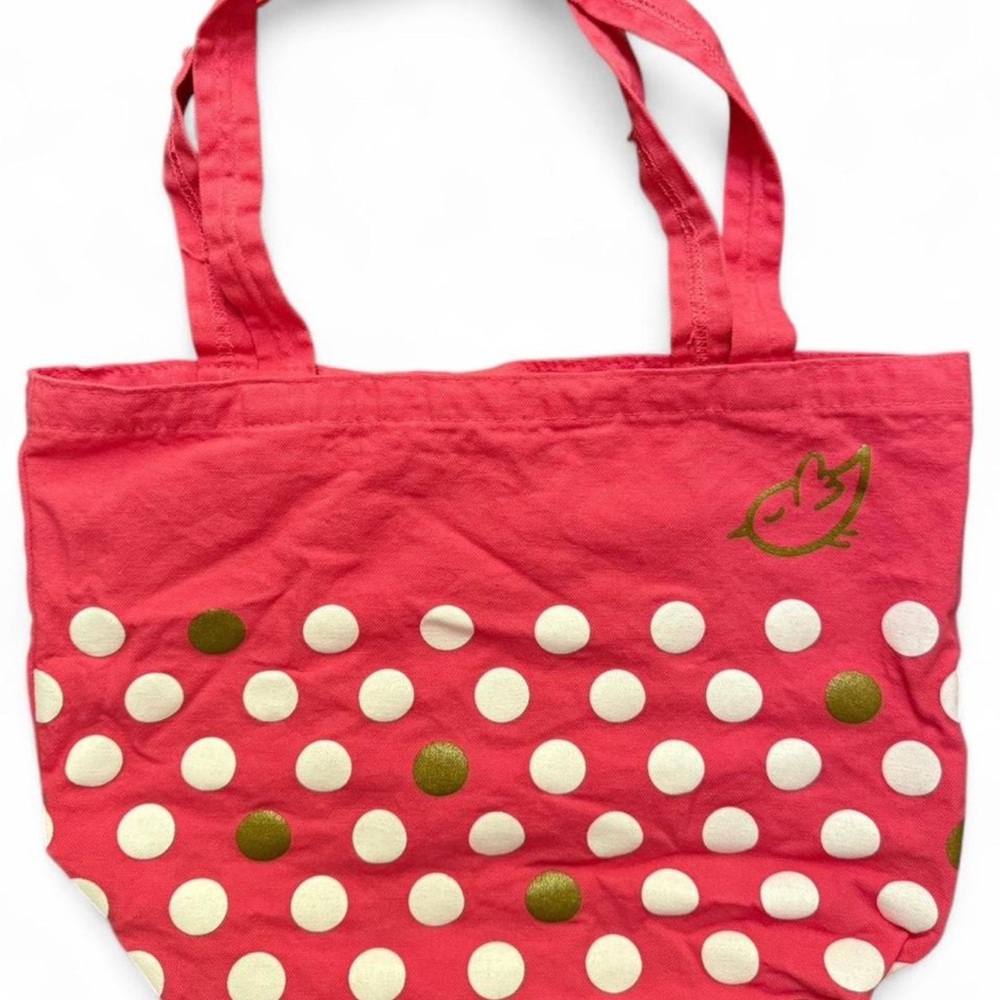 TOTE Soft red, white and gold polka dot tote bag with a small gold birdie logo